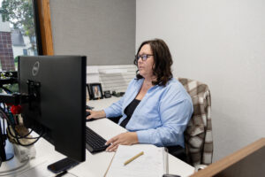 Michelle from the Help Desk on the phone with customer